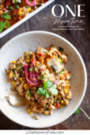 A bowl of mixed vegetables, grains, chicken, corn, and pickled onions is topped with cilantro, with a spoon beside it. Showcasing macro-friendly one-dish meals at their best, another dish is partially visible at the top. Text reads: ONE More Time. LillieEatsAndTells.com.