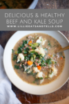 A bowl of Macro-Friendly Beef and Kale Soup with carrots, cauliflower, and greens, placed on a wooden surface, beside a gold spoon. Text above reads Delicious & Healthy Macro-Friendly Beef and Kale Soup with a website link.