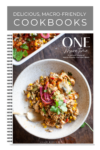 A cookbook cover titled One More Time by Lillie Biesinger, featuring a bowl of colorful, macro-friendly food topped with herbs and pickled onions, with a fork beside it. The subtitle highlights macro-friendly one-dish meals.