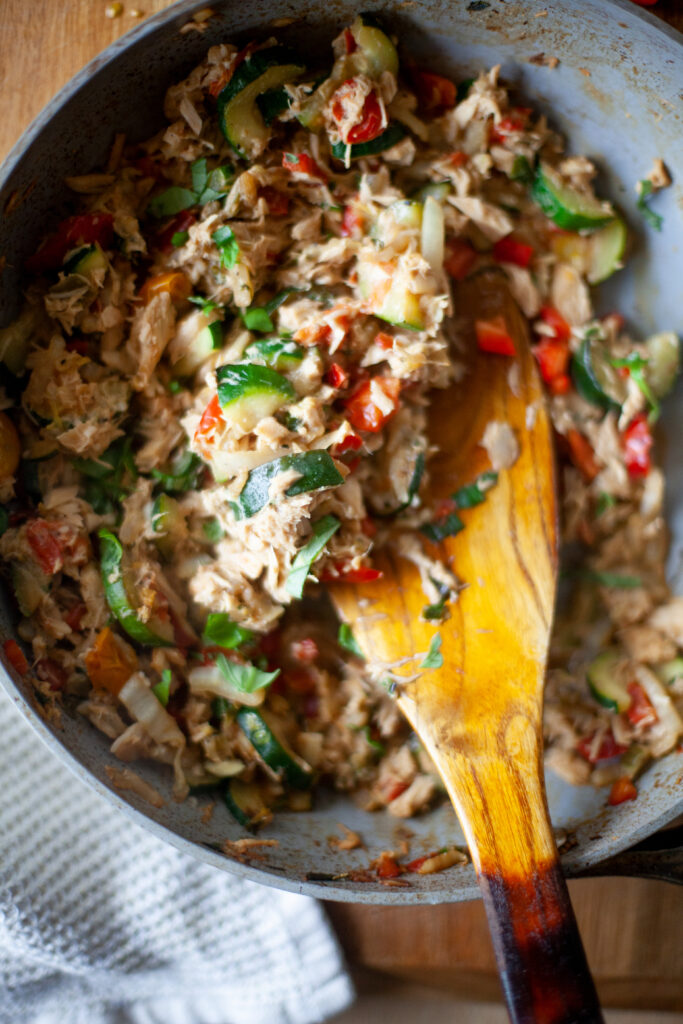 Tuna Skillet being stirred with a wooden spoon