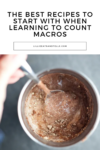 A hand stirs a spoon into a cup of chocolate dessert. Text above reads: 5 Recipes to Make Macro-Counting Easier—these are the best recipes to start with when learning to count macros. Website: lillieeatsandtells.com.