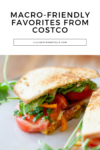 A toasted sandwich with tomato, greens, and possibly cheese, cut in half on a white surface. Text above reads Macro-Friendly Costco Favorites from lillieeatsandtells.com.