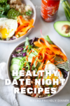 Two bowls filled with colorful salad, ground meat, fried eggs, carrot ribbons, cucumber, and avocado. Sriracha bottle and avocado half in background. Text reads: Healthy Date Night Recipes. Perfect for your next date night at home—these macro-friendly dinners make delicious Date Night at Home Recipes you’ll both love.