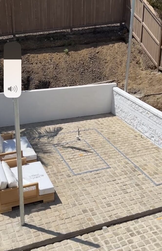 Before my outdoor kitchen was installed. Pavers with the L-design marked out.