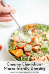 A hand holds a spoonful of creamy chimi­churri over a fresh salad with tomatoes and greens. Text reads: Creamy Chimichurri Macro-friendly Dressing.