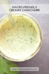 Overhead view of a jar filled with creamy green sauce and a spoon inside. Text reads Creamy Chimichurri Macro-Friendly and www.lillieeatsandtells.com.