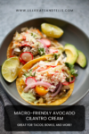 Two tacos with beef, cherry tomatoes, radishes, avocado, and creamy sauce on a gray plate, garnished with lime wedges. Text above and below highlights the macro-friendly Avocado-Cilantro Cream—perfect for tacos, bowls, and more.