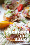 Mini tostadas topped with shredded veggies, crisp cucumber slices, and a creamy Cucumber Dill Sauce are beautifully displayed on a tray. Text on image reads: Cucumber Dill Sauce. Bright and fresh ingredients are in focus.