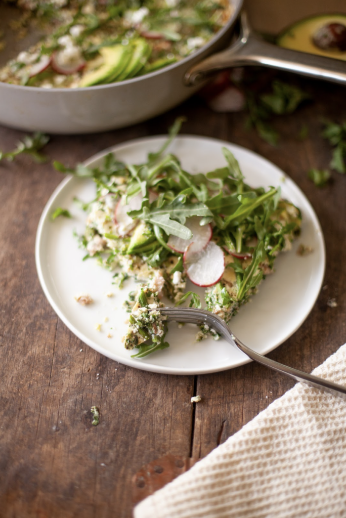 Slice of spring frittata on plate.