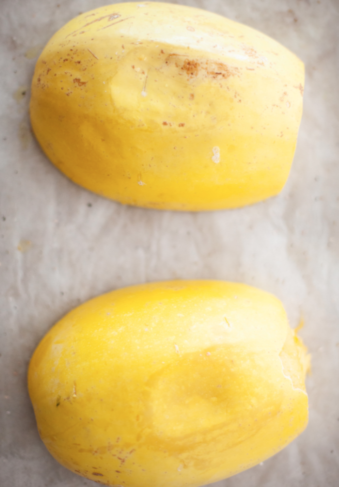 upside down spaghetti squash prepared for baking in the oven