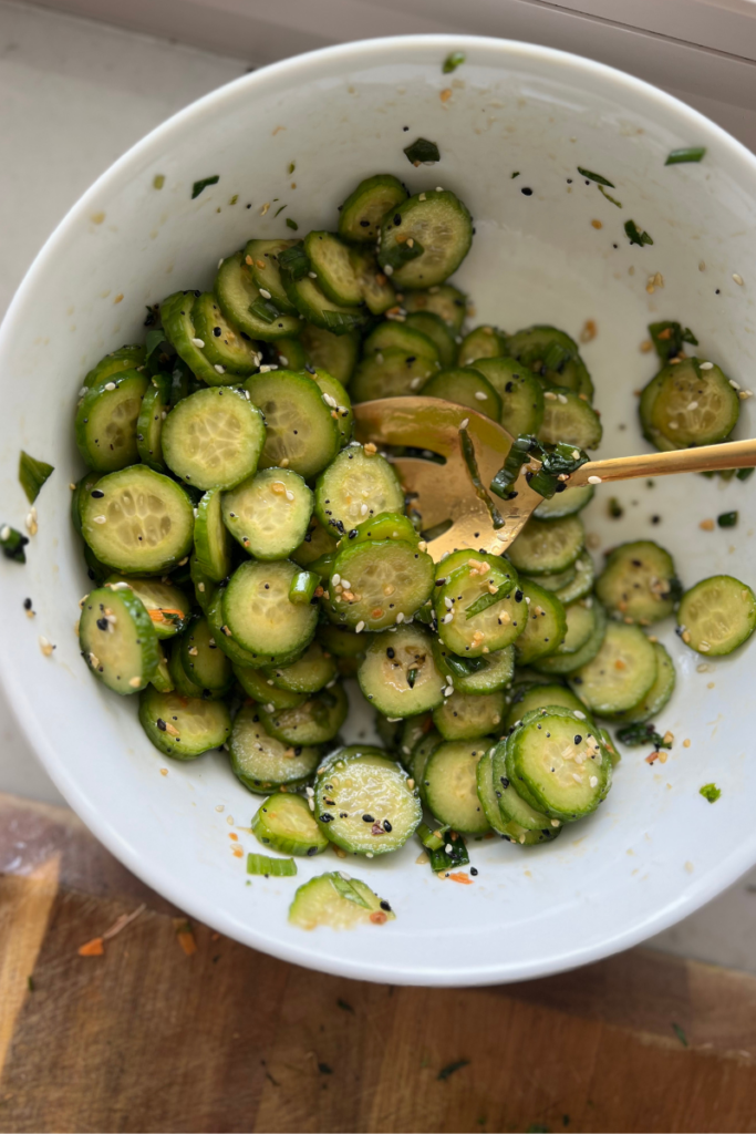 up close shot of macro-friendly sesame cucumber salad by lillieeatsandtells.com