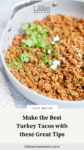 Ground turkey in a skillet. The purpose of the image is a pinterest pin.