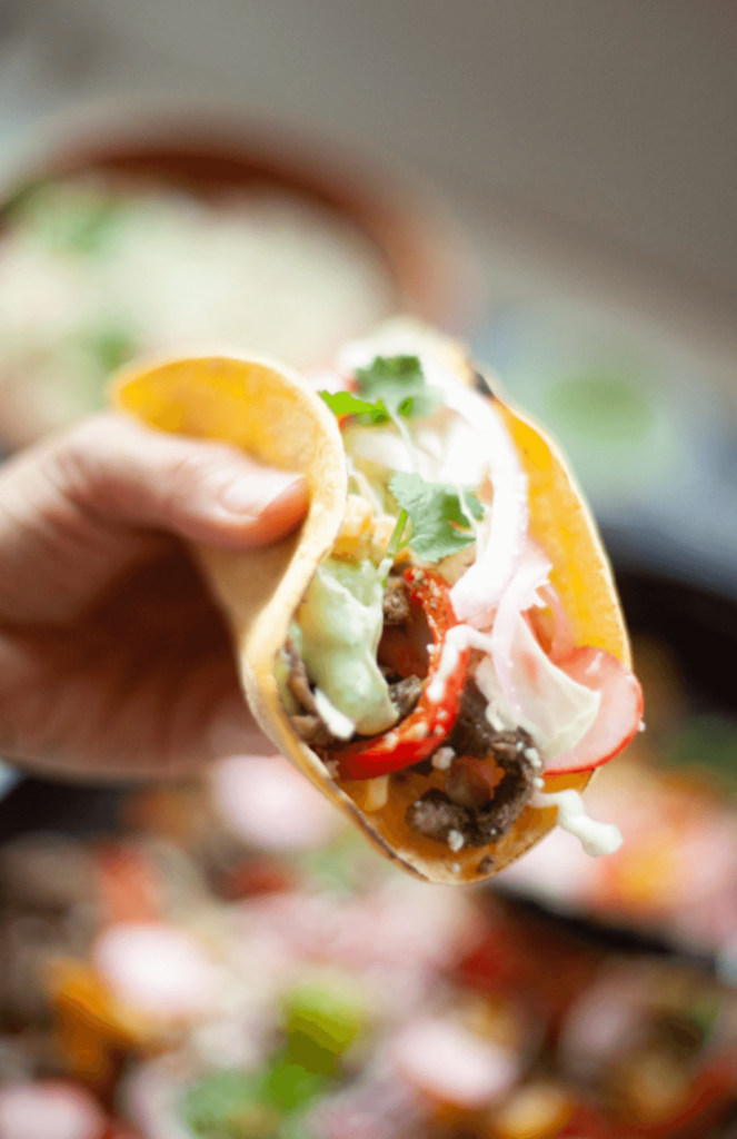 Close-up of avocado cream on a taco