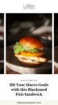 Fish sandwich with heirloom tomatoes on a white plate