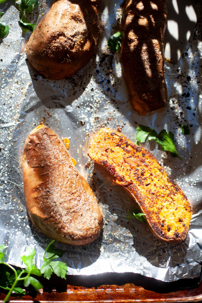 Roasted sweet potatoes with salt on the skins.