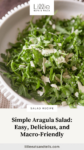 Close up of arugula salad with text overlay, "Simple Arugula Salad, Easy, Delicious, and Macro-Friendly."