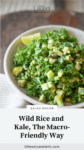 Bowl of salad with white napkin on side with text overlay, "Wild Rice and Kale, The Macro-Friendly Way."