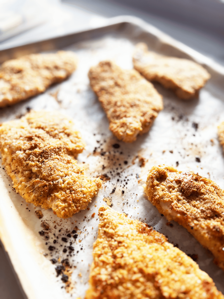 Close up of baked breaded chicken.