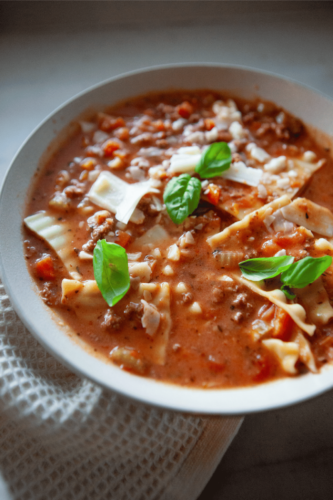 Bowl of low-carb lasagna soup with basil.