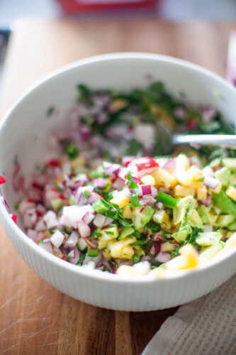 Close up of pineapple radish salsa with jalapeno and lime juice.