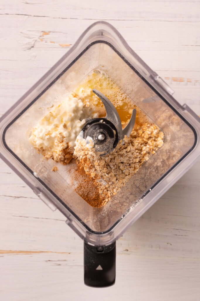 Ingredients added to blender for cottage cheese pancakes.