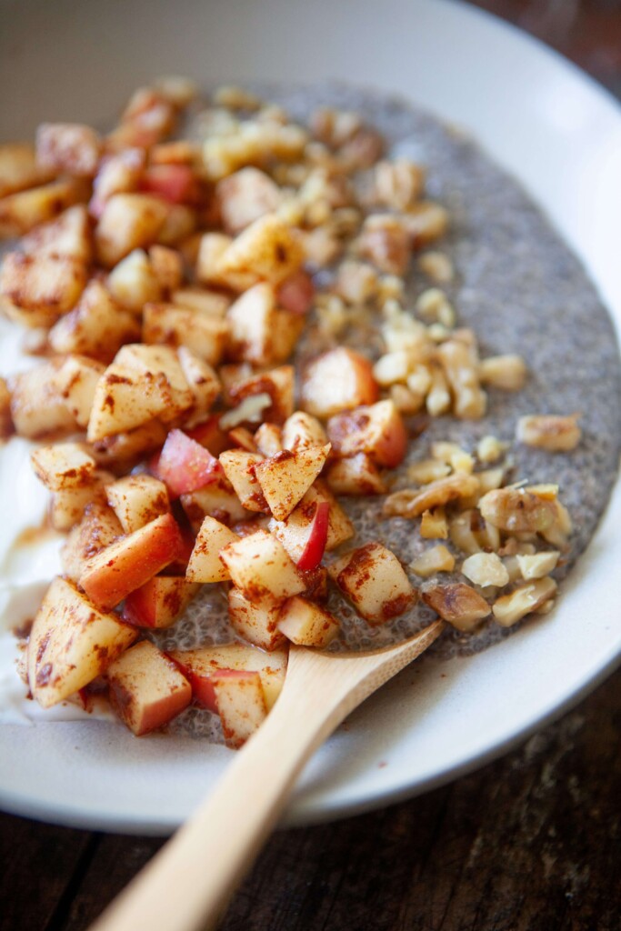 Diced apples, chia pudding and greek yogurt in a bowl.