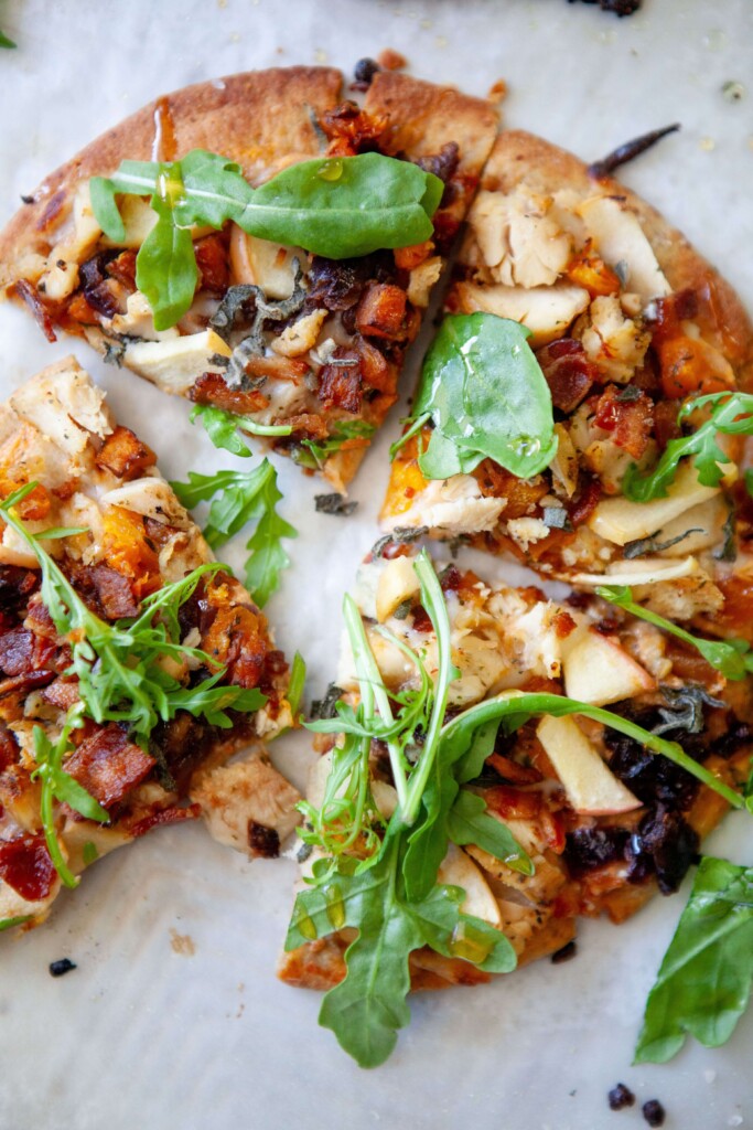 Butternut squash, bacon and onion flatbread vut into four triangles.