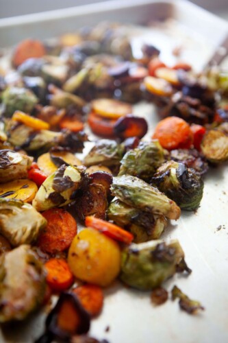 Roasted fall veggies on baking dish.