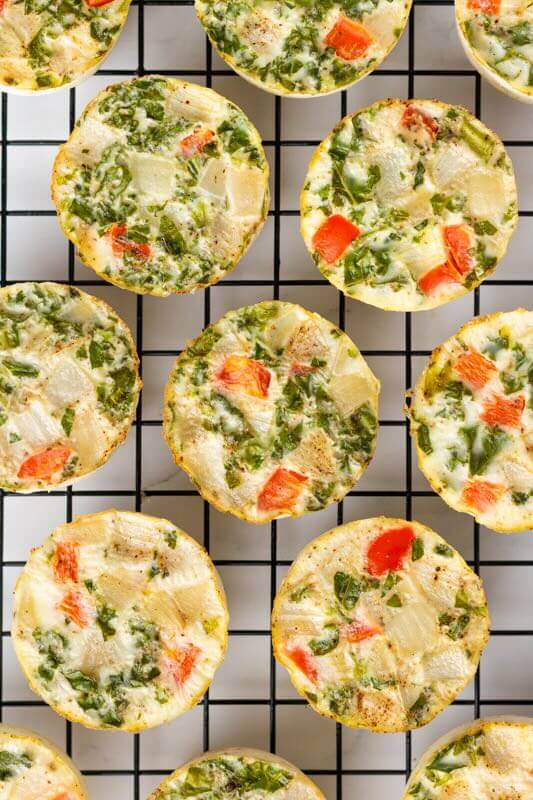 Egg white cups cooling on wire rack.