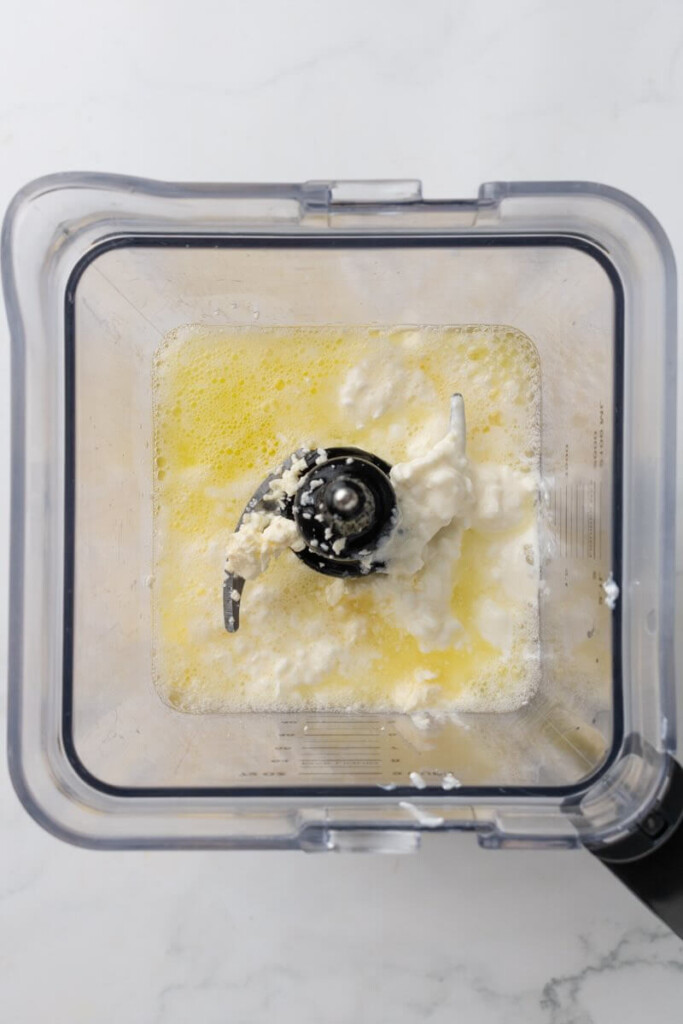 Egg whites, cottage cheese and feta cheese in blender.