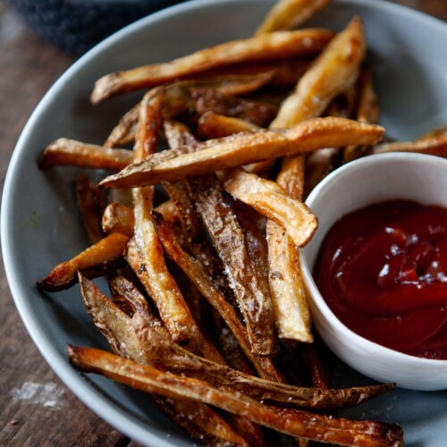 Healthy french fries in bowl with ketchup.