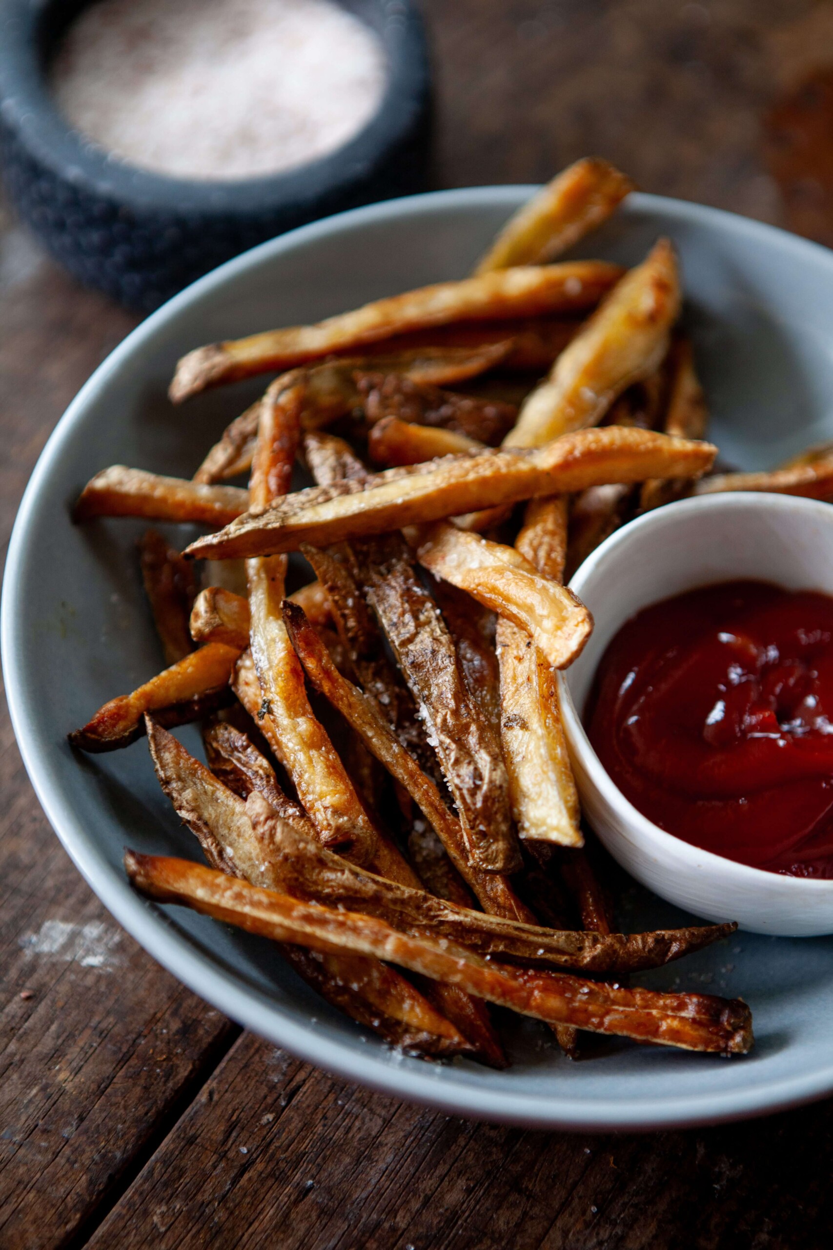 Healthy french fries in bowl with ketchup.