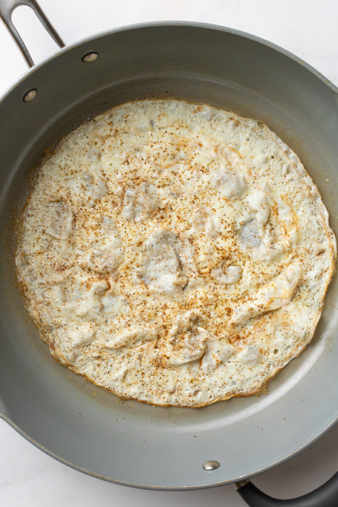 Egg whites cooked in pan.